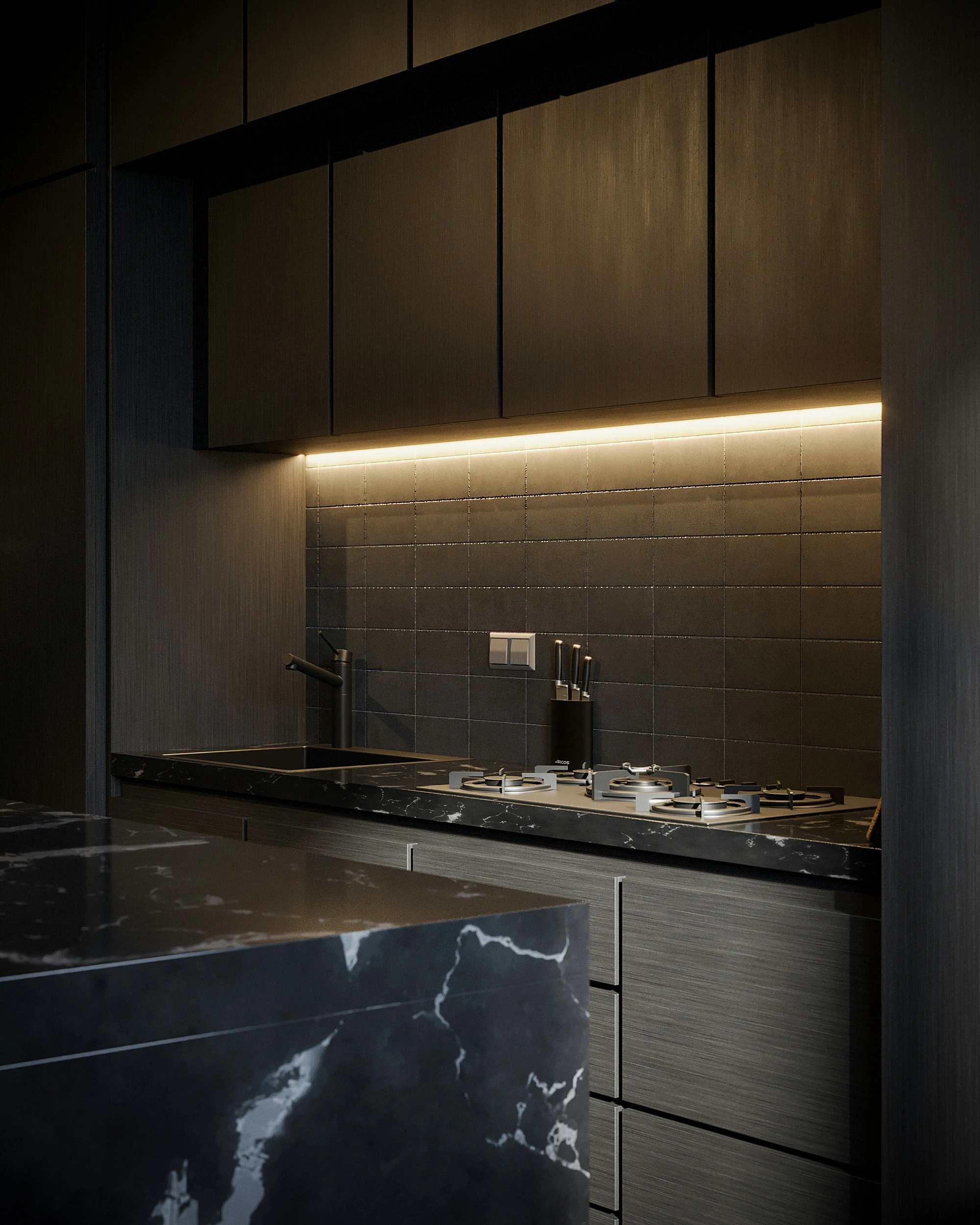 Turnkey luxury kitchen staging featuring dark oak cabinetry, black marble island, and warm illumination